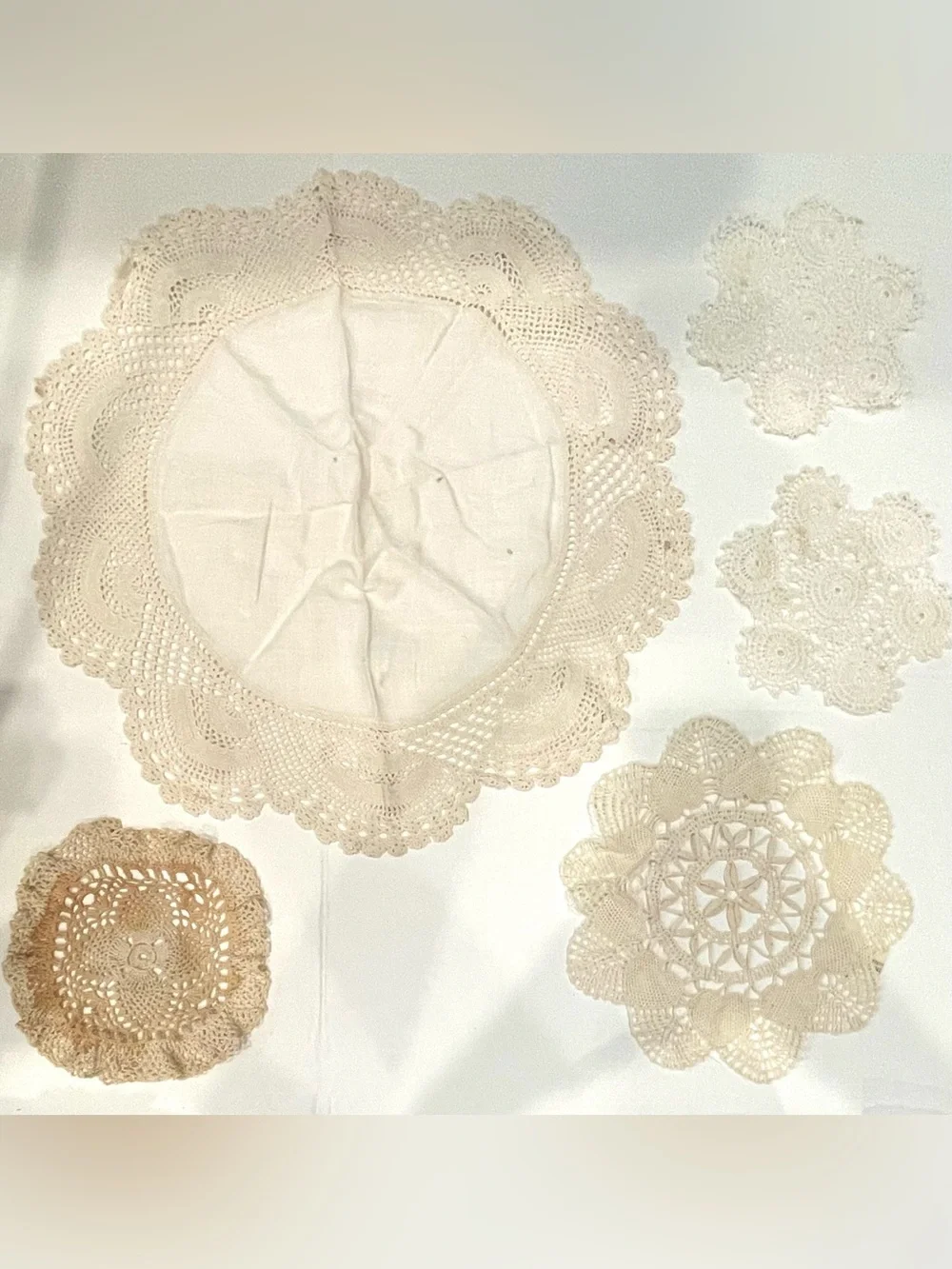 Lot of five vintage doilies