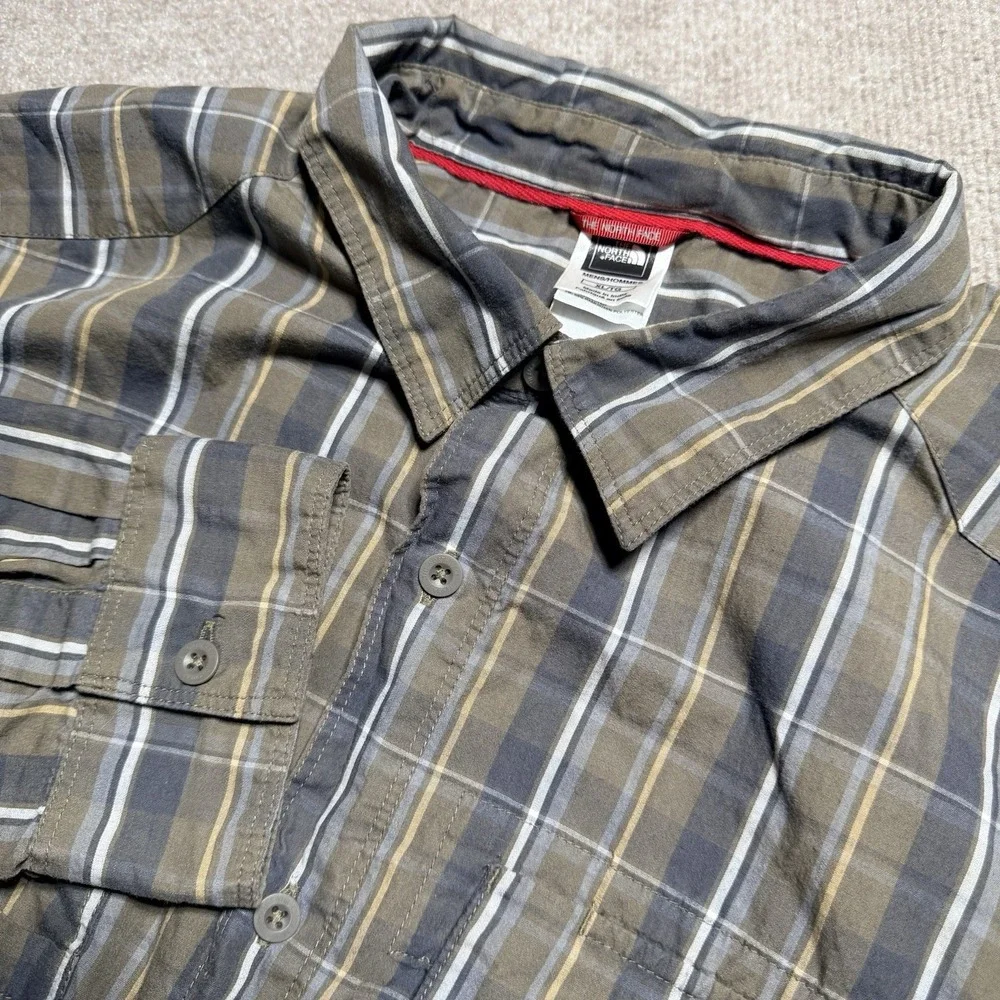 The North Face plaid tears