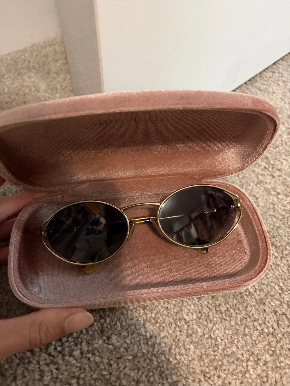 Miu Miu Oval Sunglasses