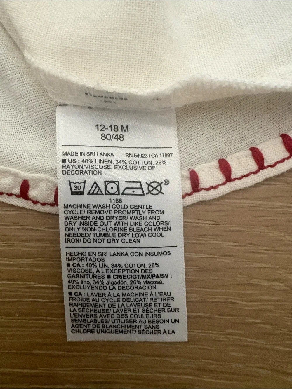 NWT Cream Sleeveless Embroidered Kids Top with Red Trim; 12-18 months