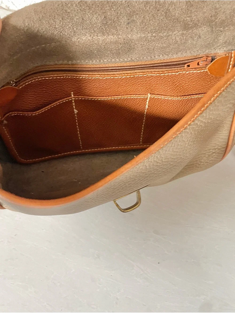 Dooney & Bourke piece notches