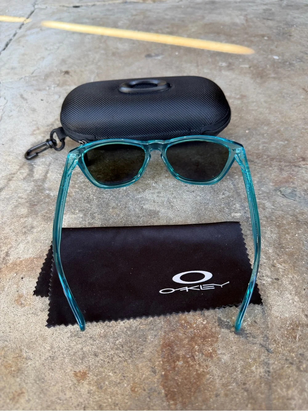 Oakley Teal Translucent Frame Sunglasses with Vibrant Blue Polarized Lenses
