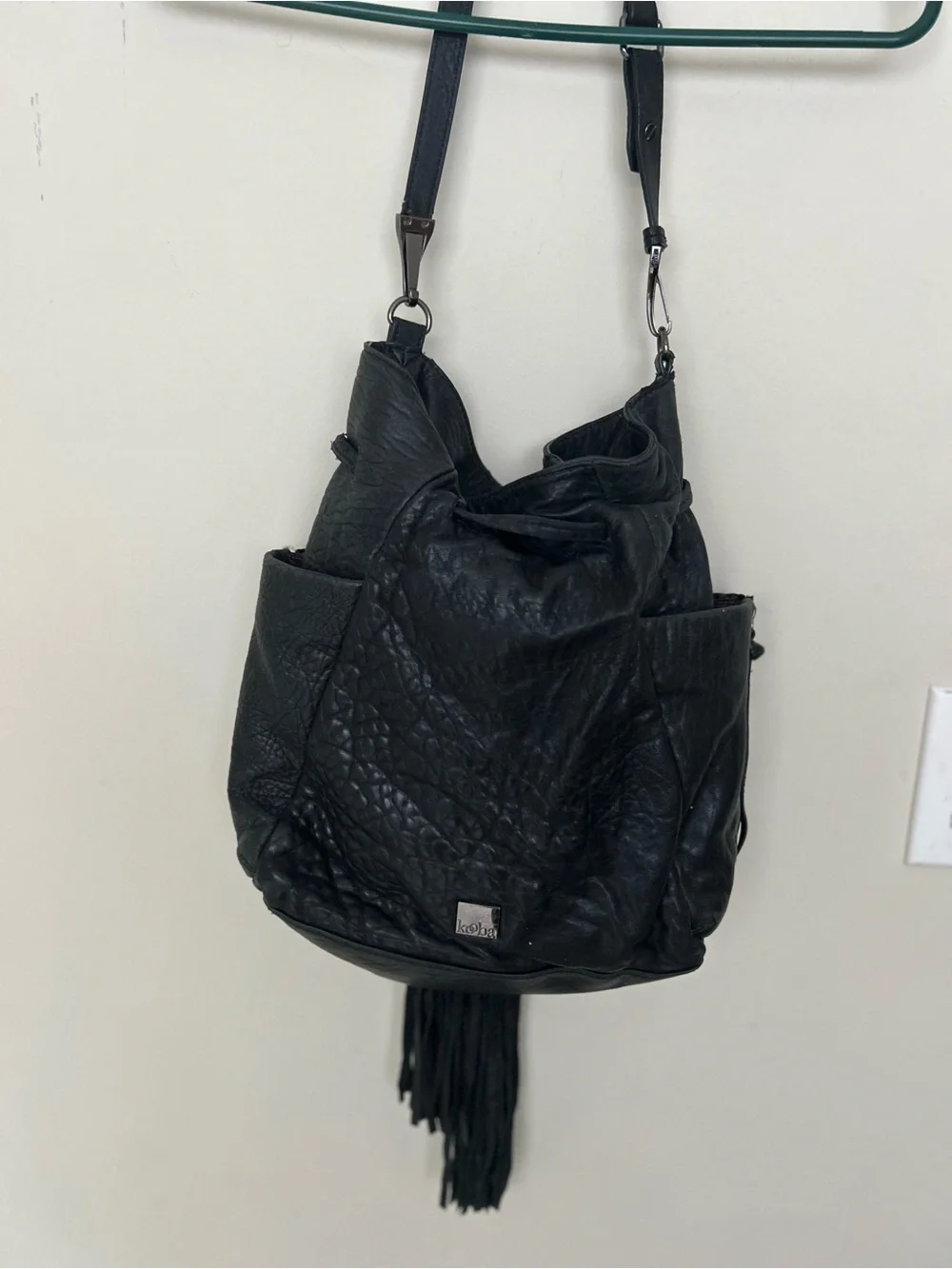 vintage Kooba hobo bag, drawstring closure, fringe tassels, exterior pockets.