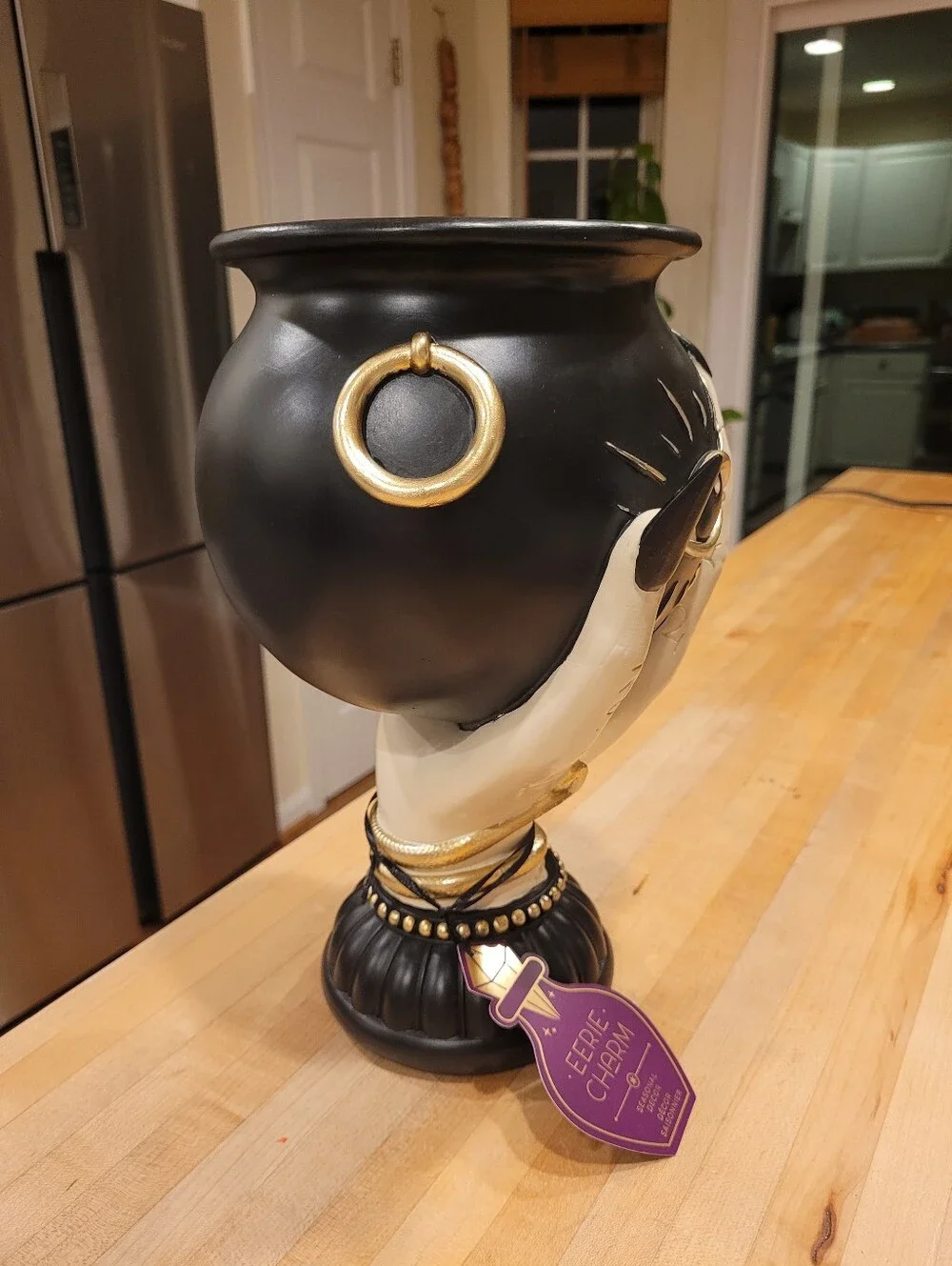 Eerie Charm Evil Eye Cauldron Held By A Witch's Hand - Black and Cream
