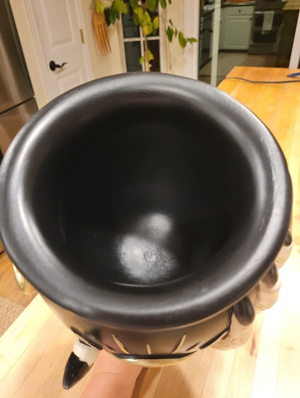 Eerie Charm Evil Eye Cauldron Held By A Witch's Hand - Black and Cream