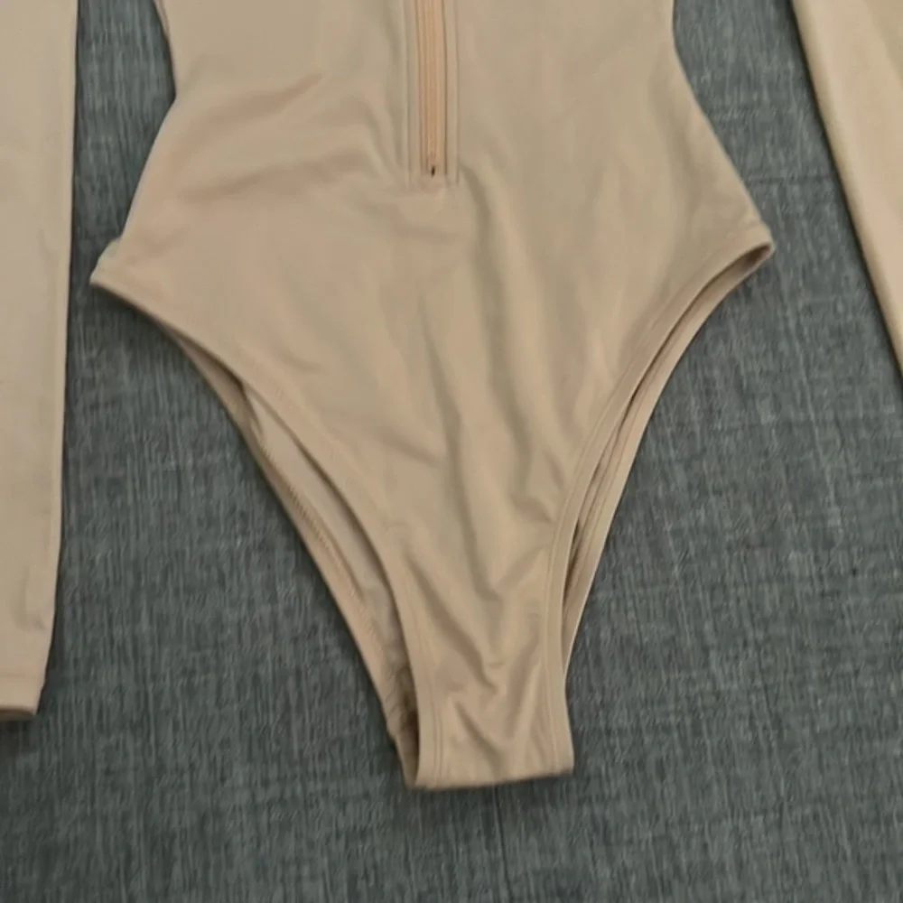 SKIMS swim zip