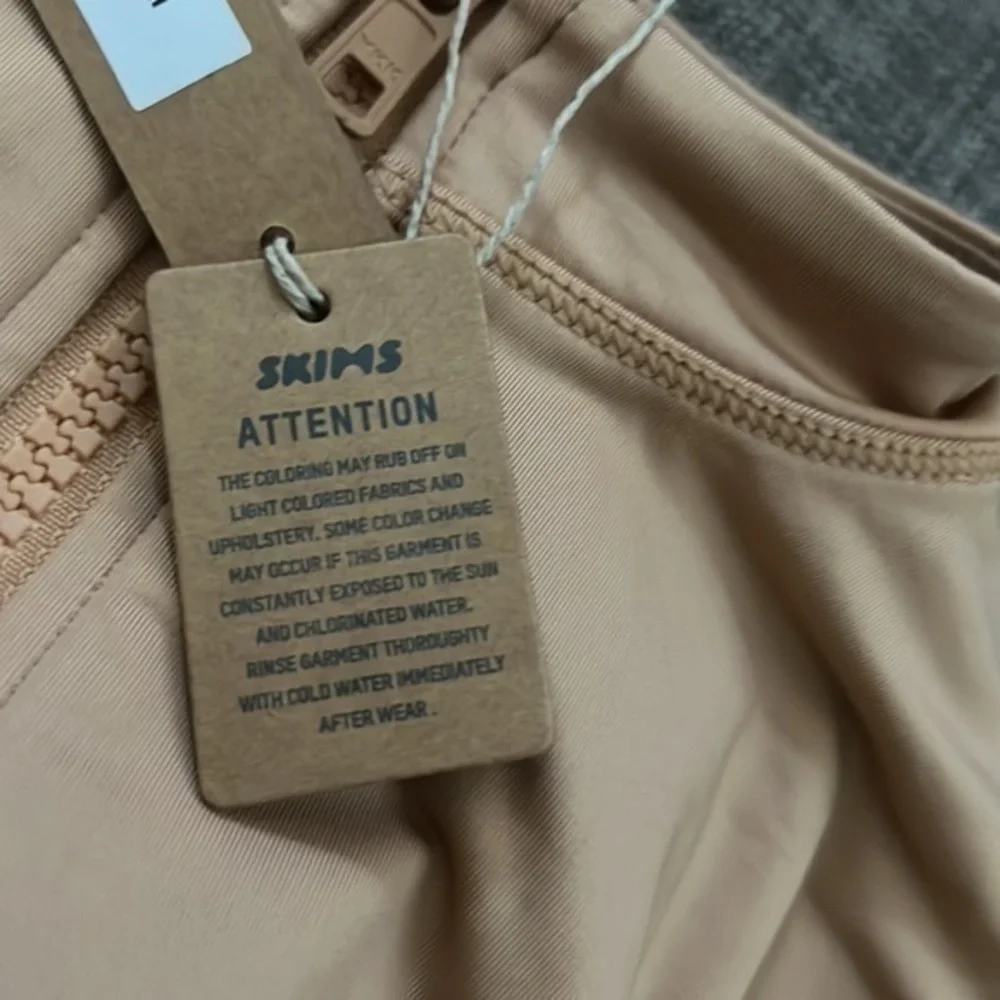 SKIMS swim zip