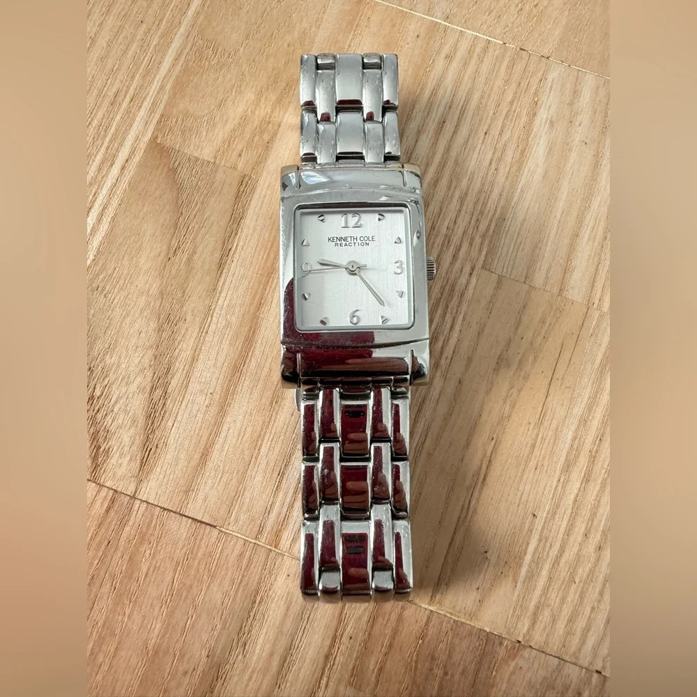 Kenneth Cole reaction ladies rectangular silver tone watch NEW BATTERY
