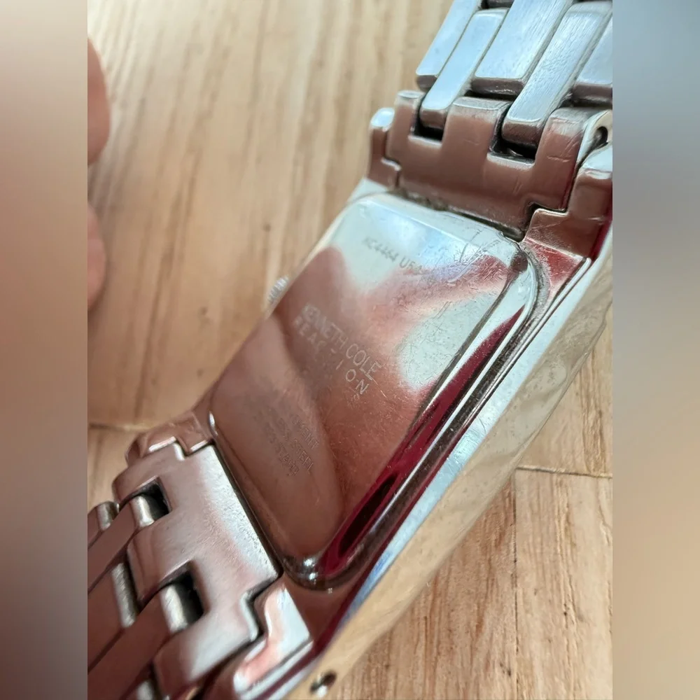 Kenneth Cole reaction ladies rectangular silver tone watch NEW BATTERY
