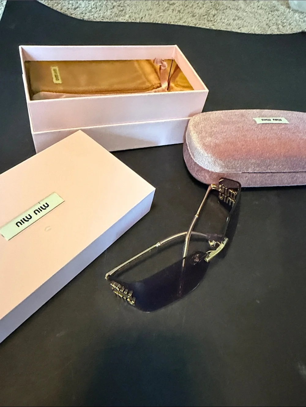 Miu Miu Rimless Sunglasses with Purple Gradient Lenses and Gold Accents