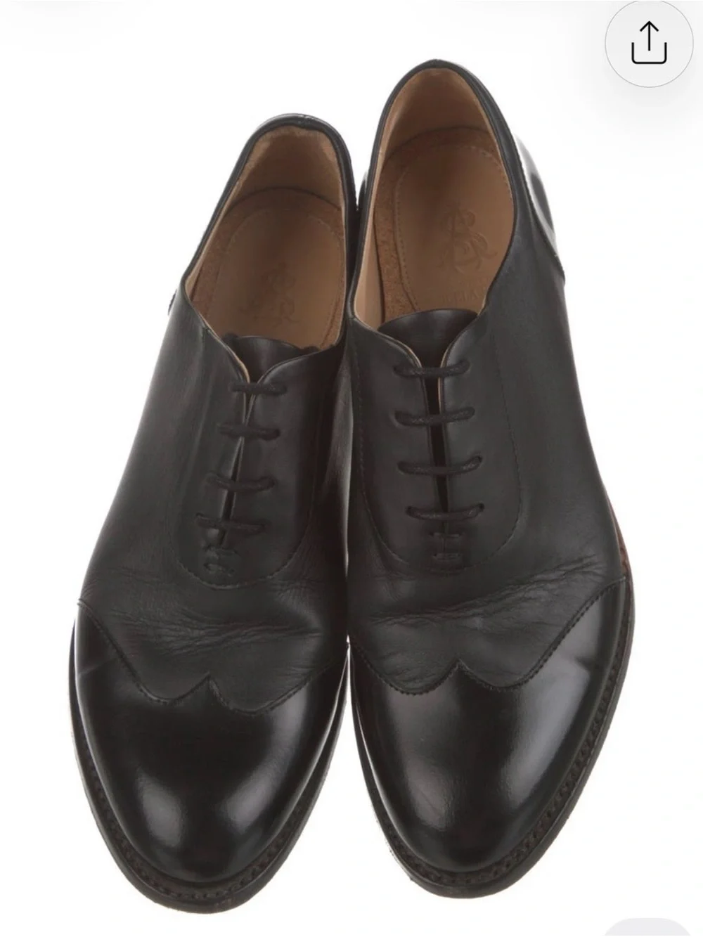 The Office Of Angela Scott polished black