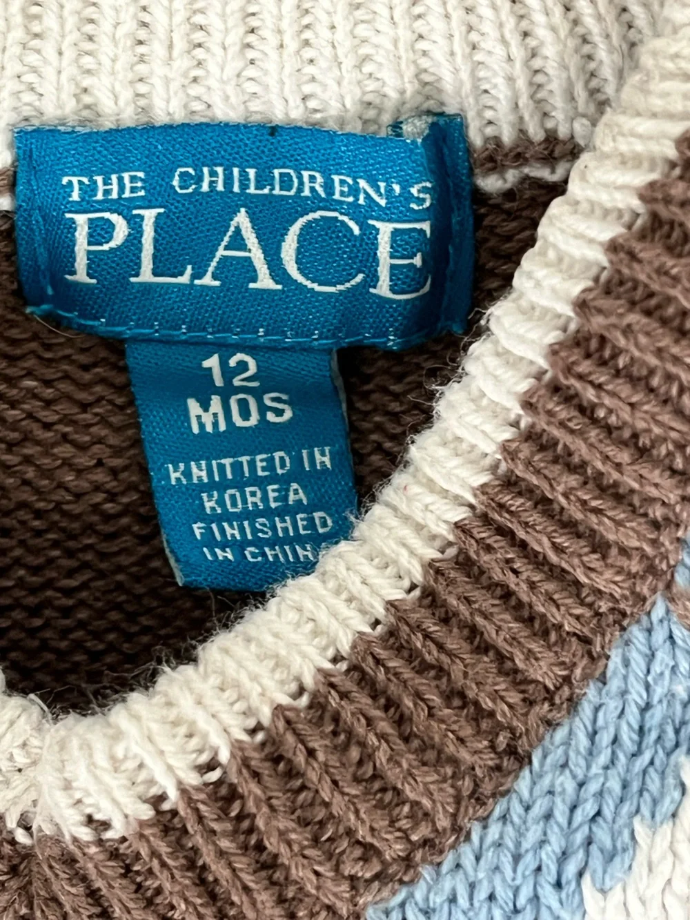 Place sleeveless crewneck