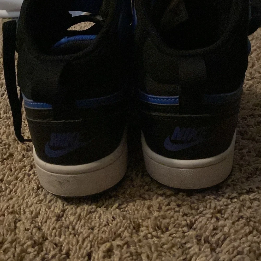 Nike youth size 4.5 black and blue high top with Velcro strap and laces