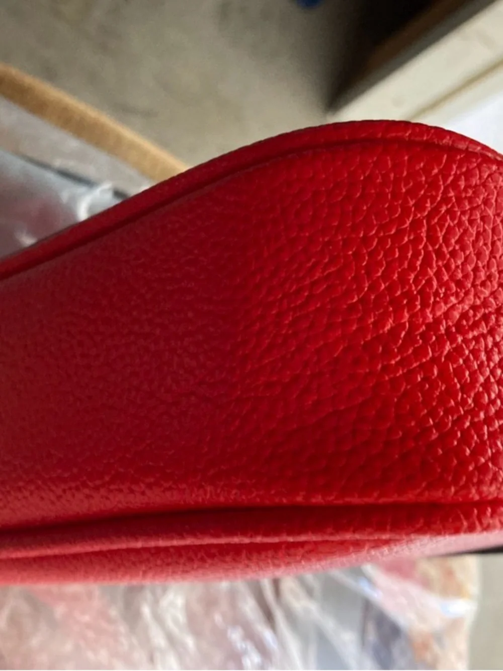 Compact Red Crossbody Bag with Tassel Accent