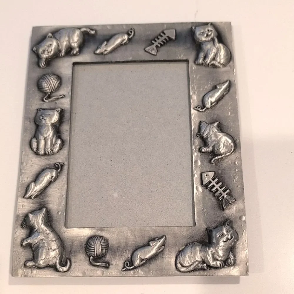 Source Unknown charming pewter