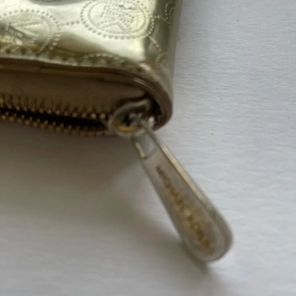 Michael Kors Gold metallic leather Jet Set Zip Around Wallet