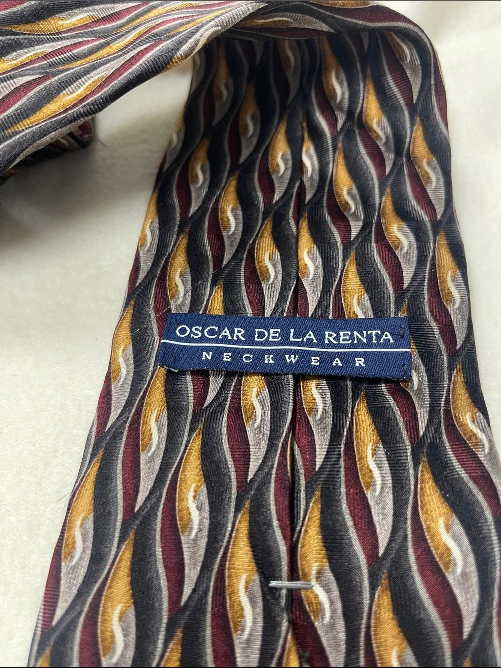 Oscar de la Renta Silk Tie in Burgundy, black & Gold Wave Pattern