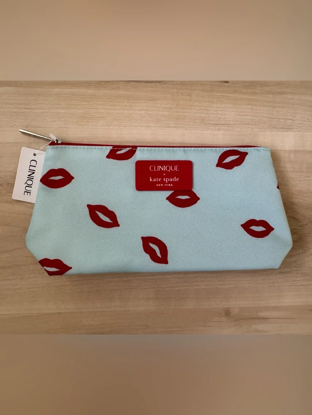 Clinique x kate spade Cosmetic Pouch in Light Blue with Red Lip Print