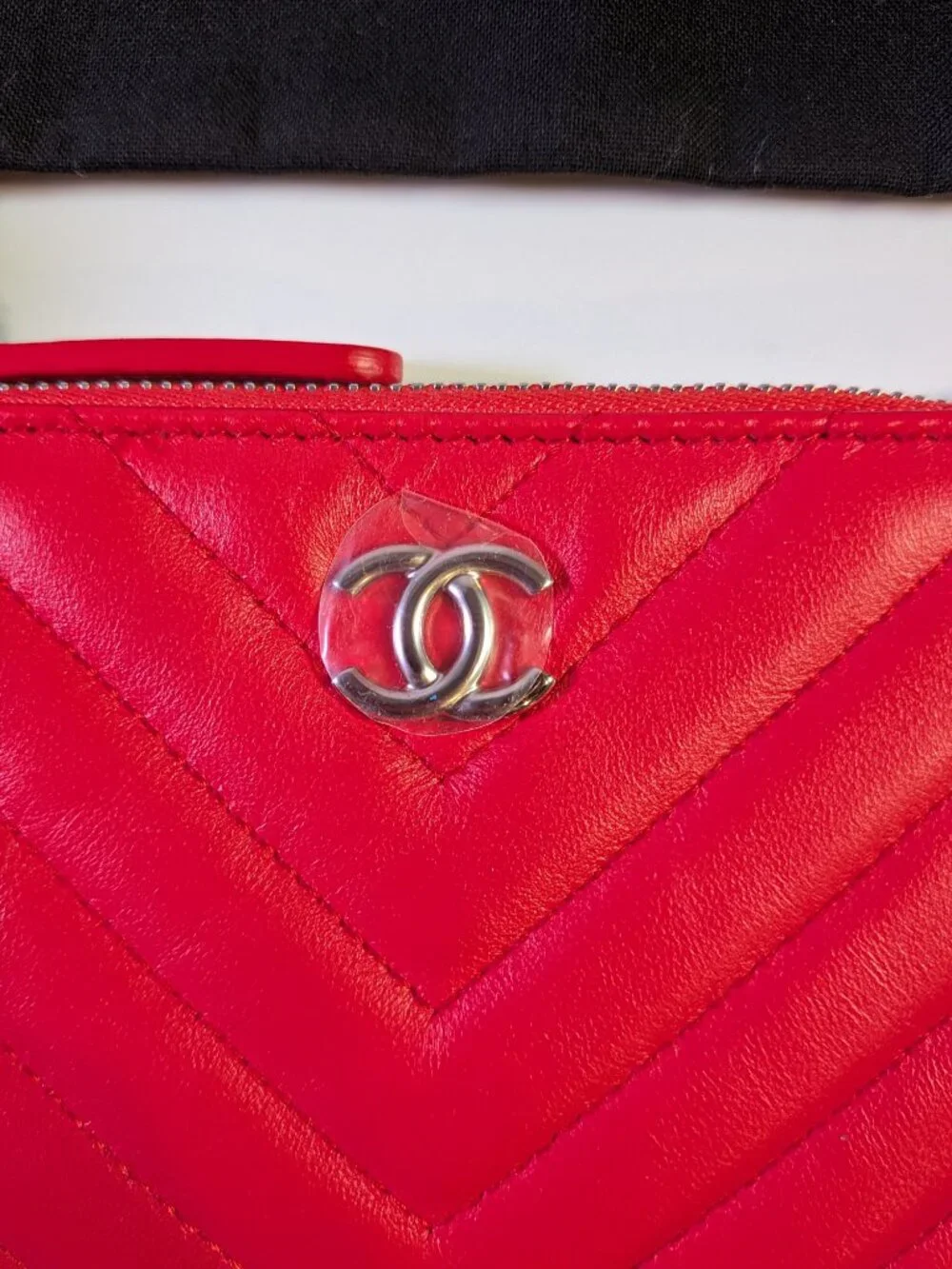 CHANEL Mini O-Case Zip Pouch — Red Chevron Quilted Lambskin, Studded Trim