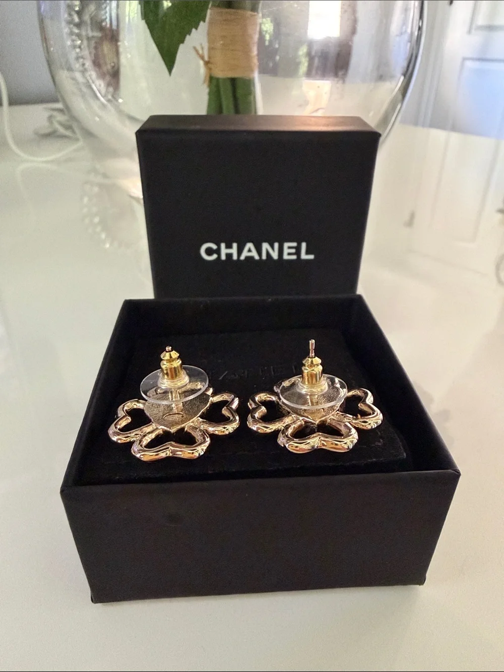 CHANEL earrings featuring