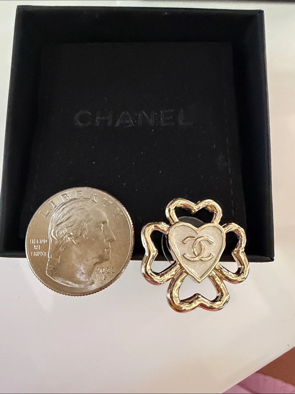 CHANEL earrings featuring