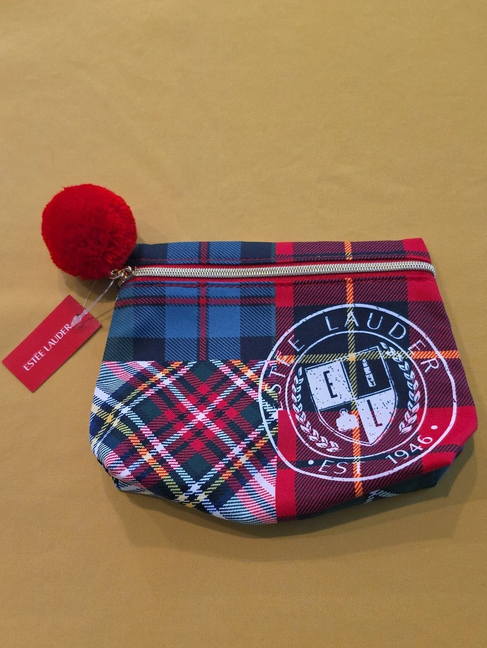 NWT Estée Lauder Plaid Tartan Cosmetic Bag Recycled Fabric Varsity Crest Pom Pom