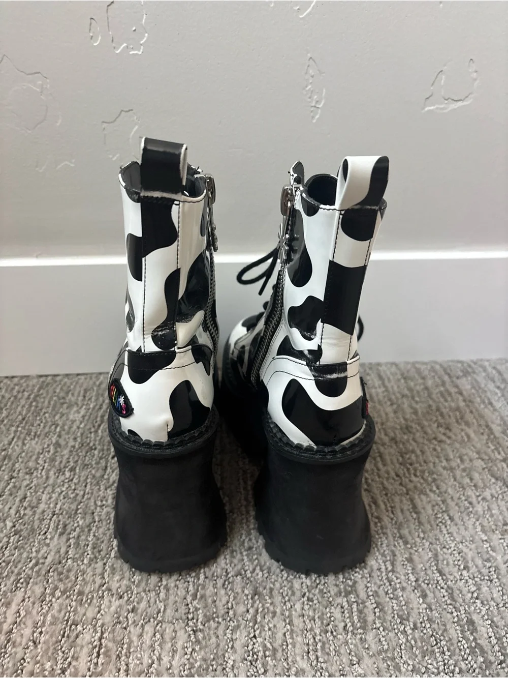 dELiA*s Black and White Cow-Print Platform Lace-Up Boots