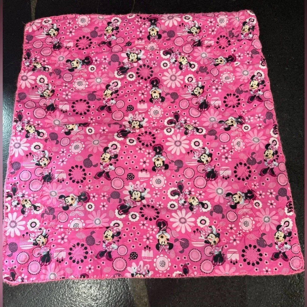 This is a handmade crocheted Minnie Mouse granny square blanket.