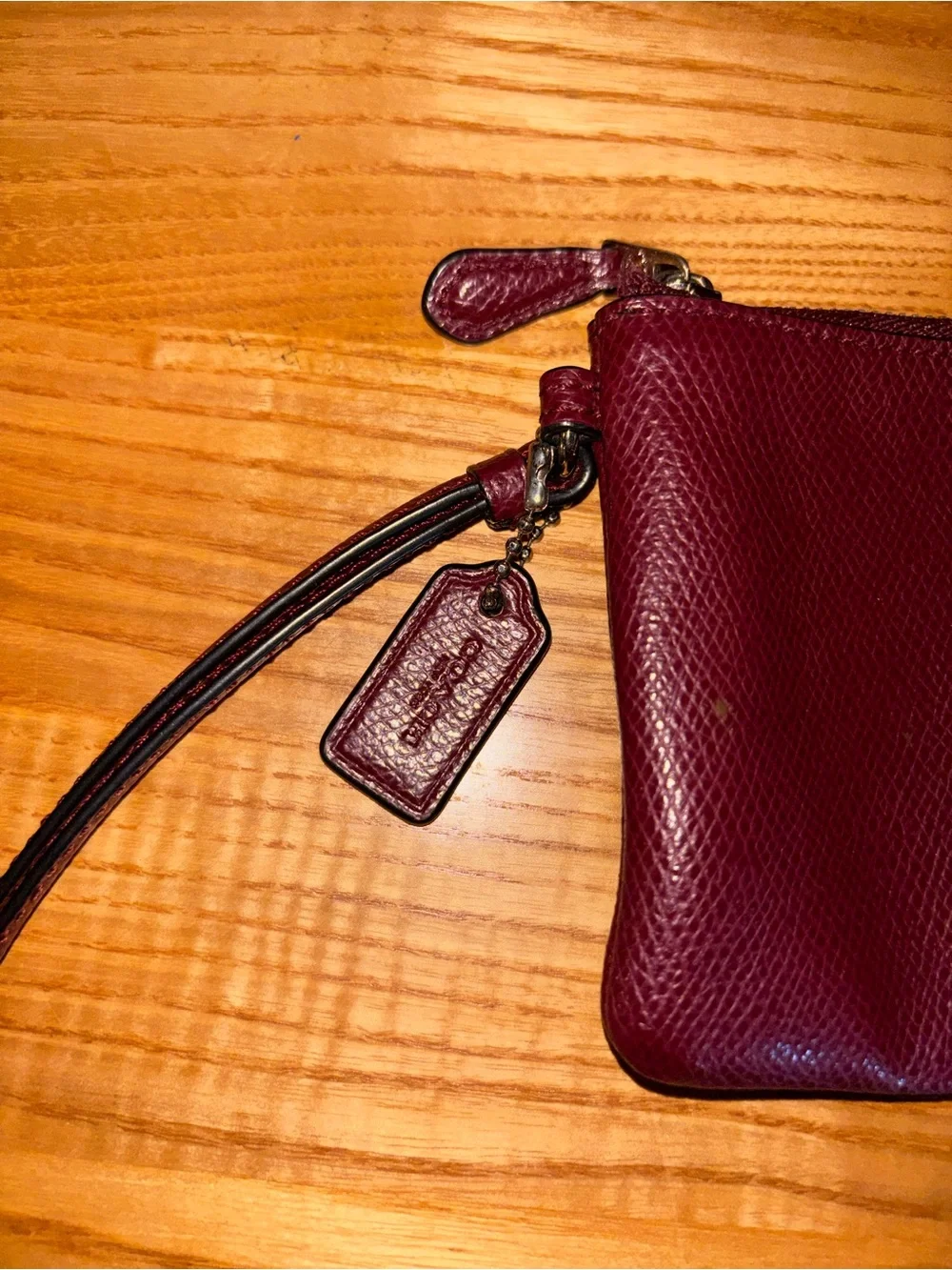 Coach Burgundy Pebbled Leather Wristlet with Gold Logo