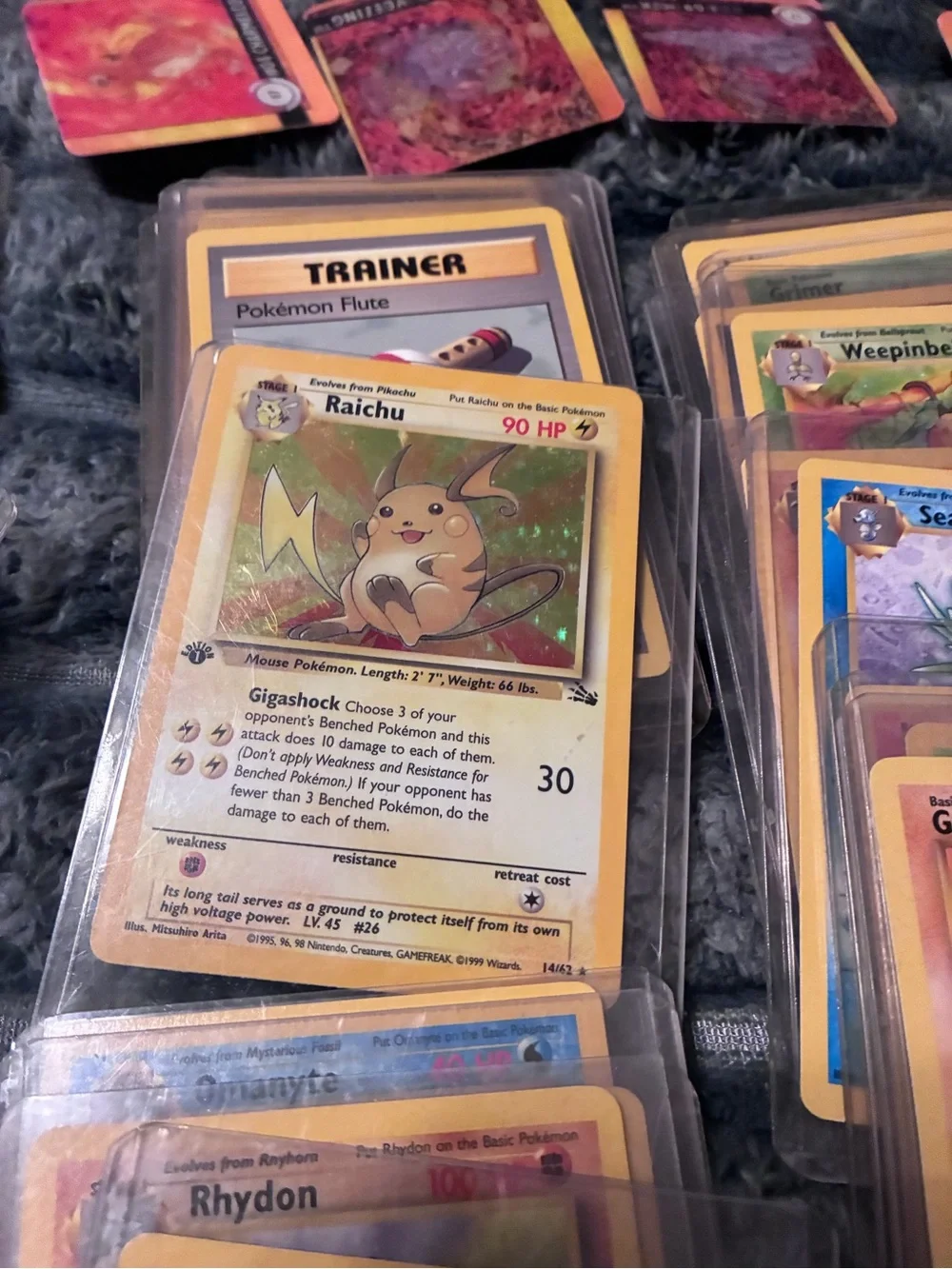 Pokemon Trading Card Lot - Assorted Colors 1997-98 trading cards in plastic hold
