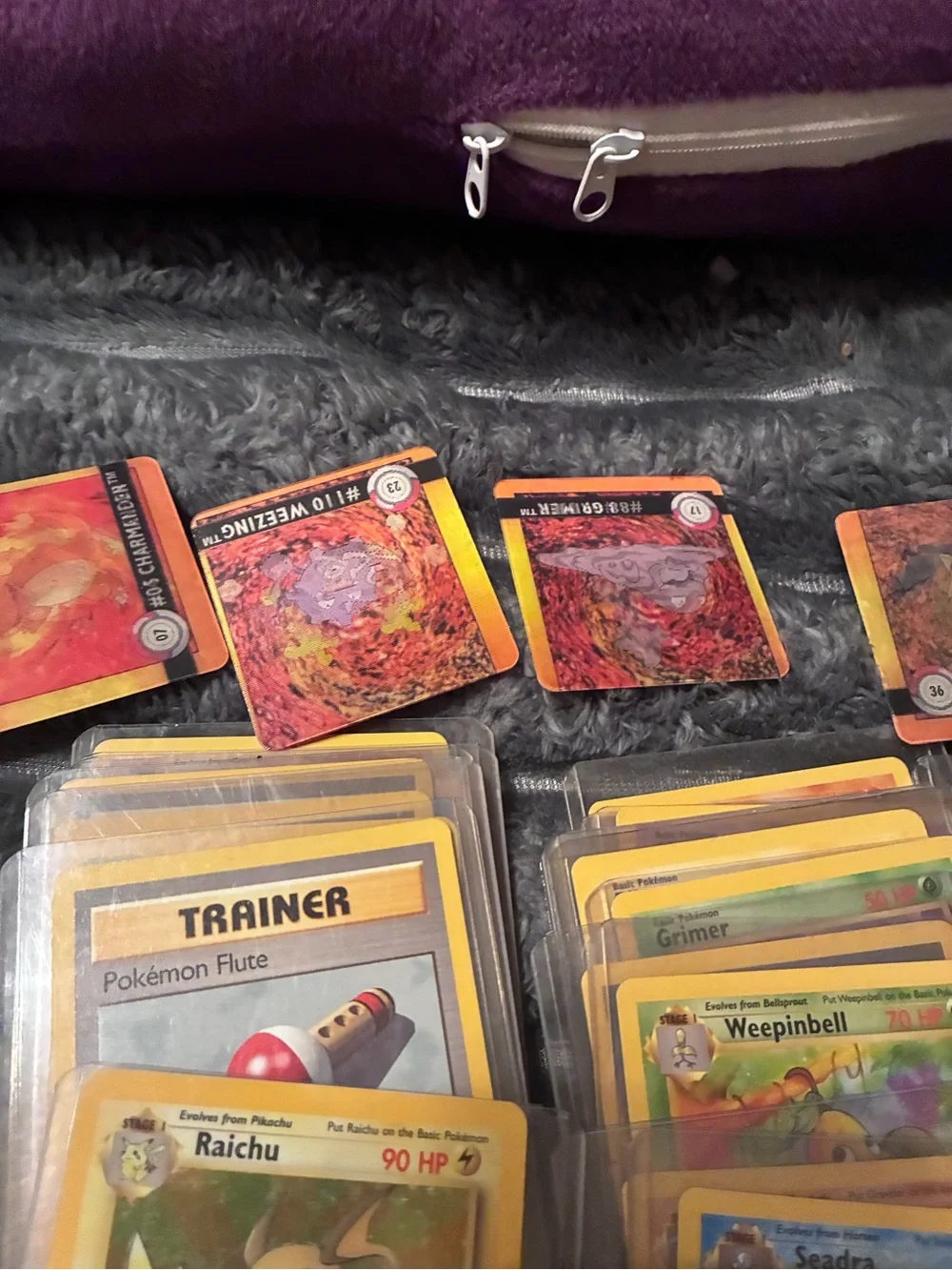 Pokemon Trading Card Lot - Assorted Colors 1997-98 trading cards in plastic hold