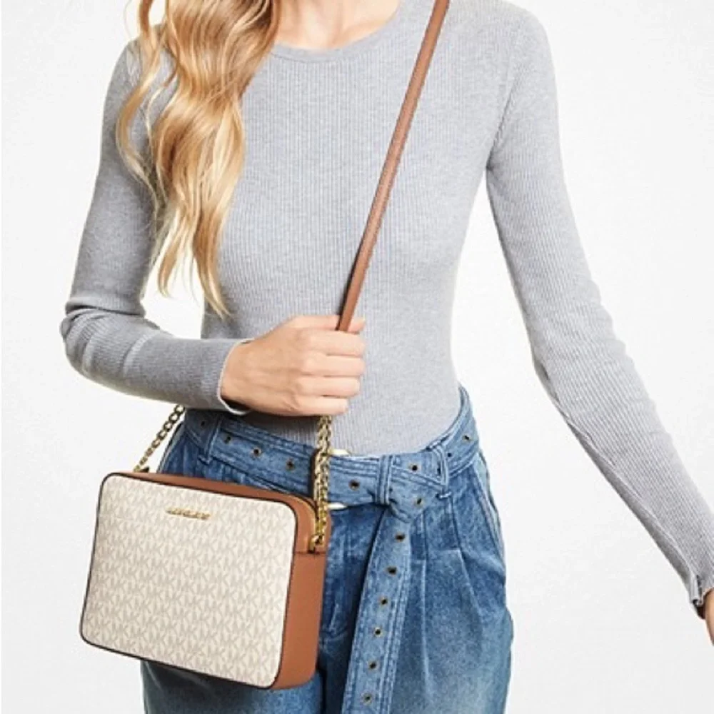 Michael Kors while scratches zip
