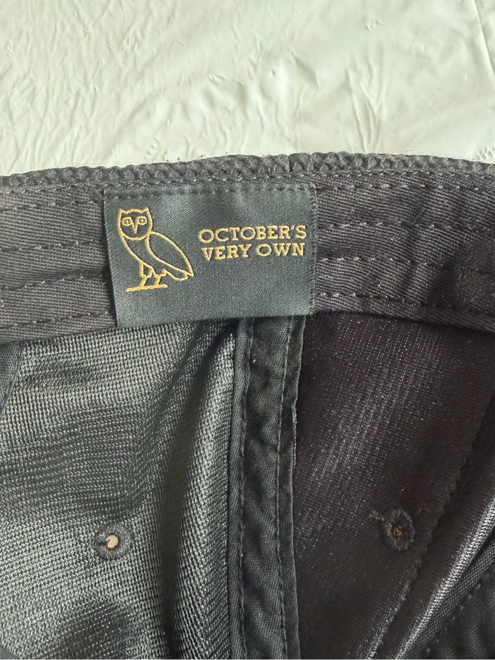 OVO Black Baseball Cap with Gold Owl Patch and Red Trim