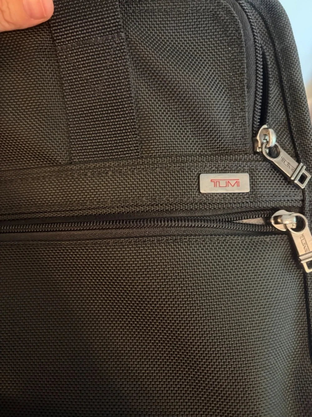 Tumi lots pockets