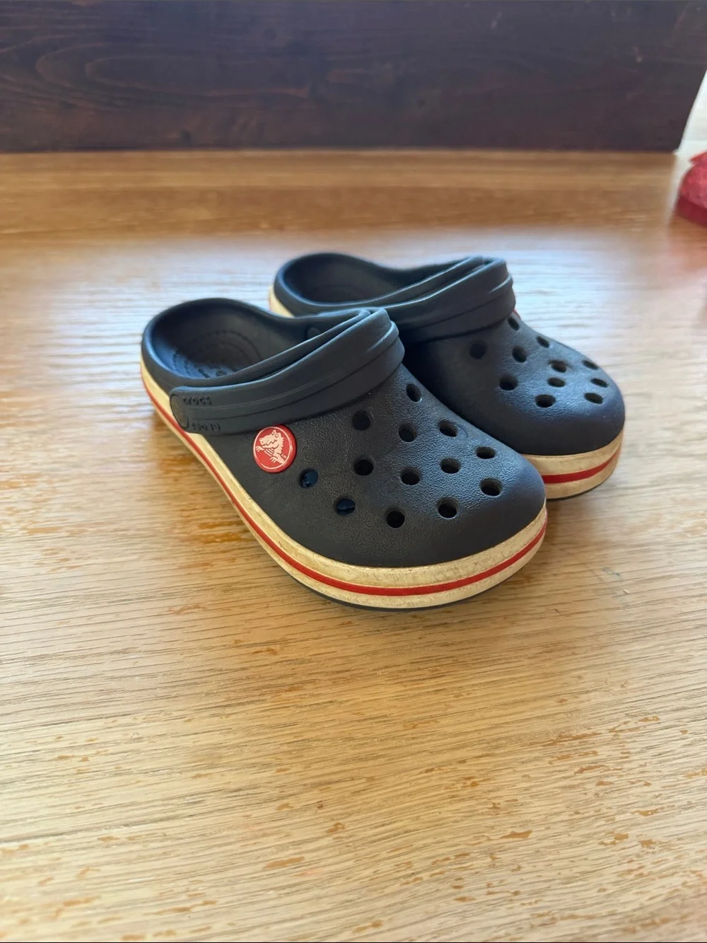 CROCS Kids Navy Clogs with Red Stripe Accent