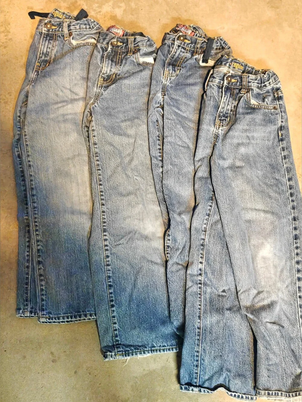 4 pair of Old Navy boys' jeans in size 10 regular. These blue jeans are designed