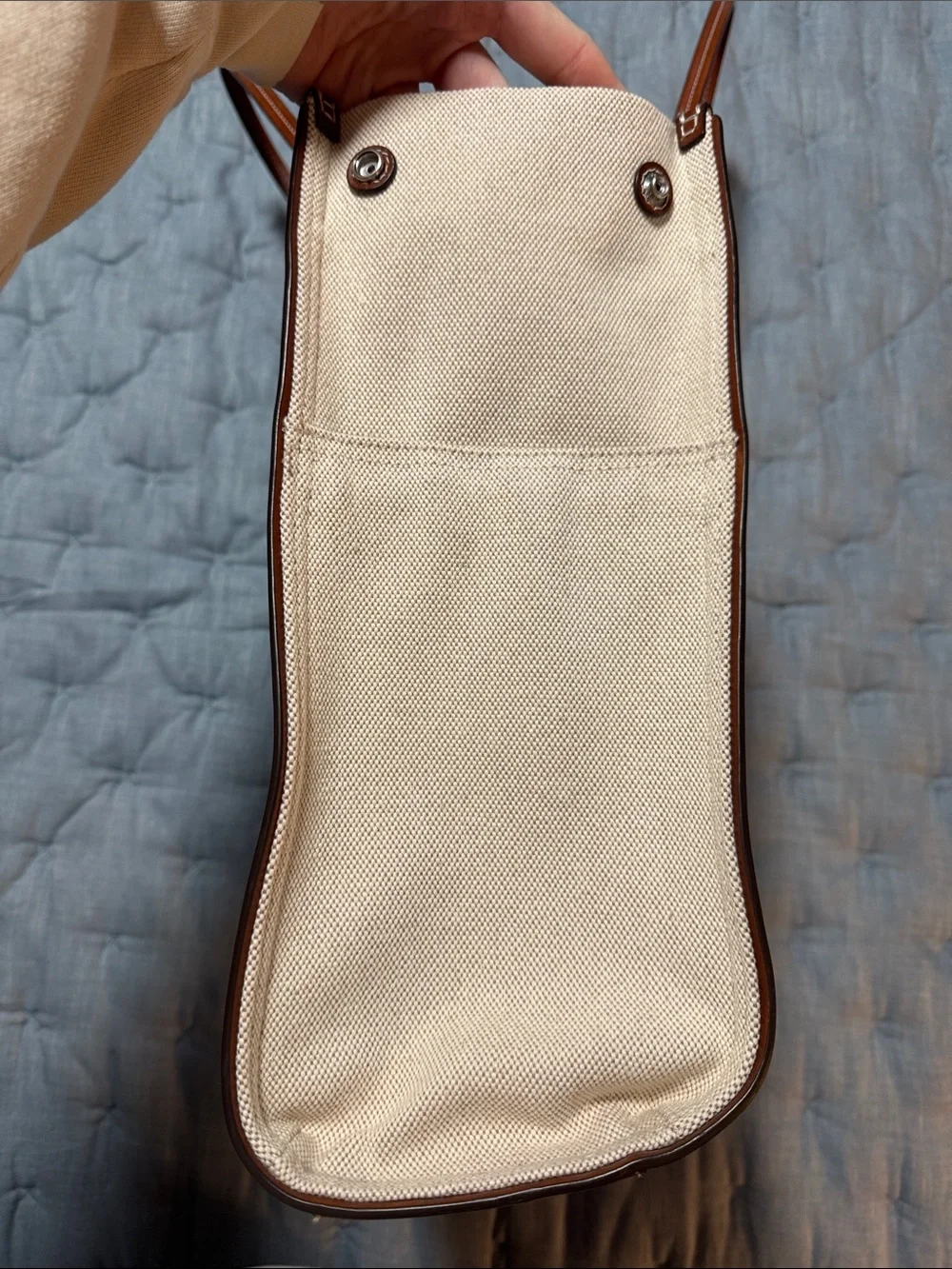 Tory Burch holds 15”