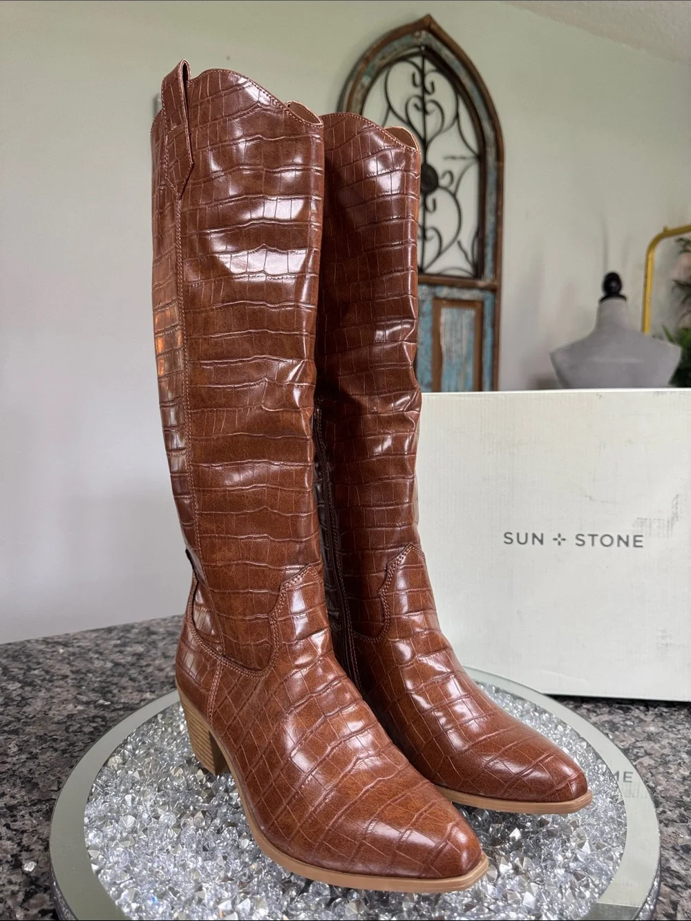 Sun + Stone inspired embossed animal