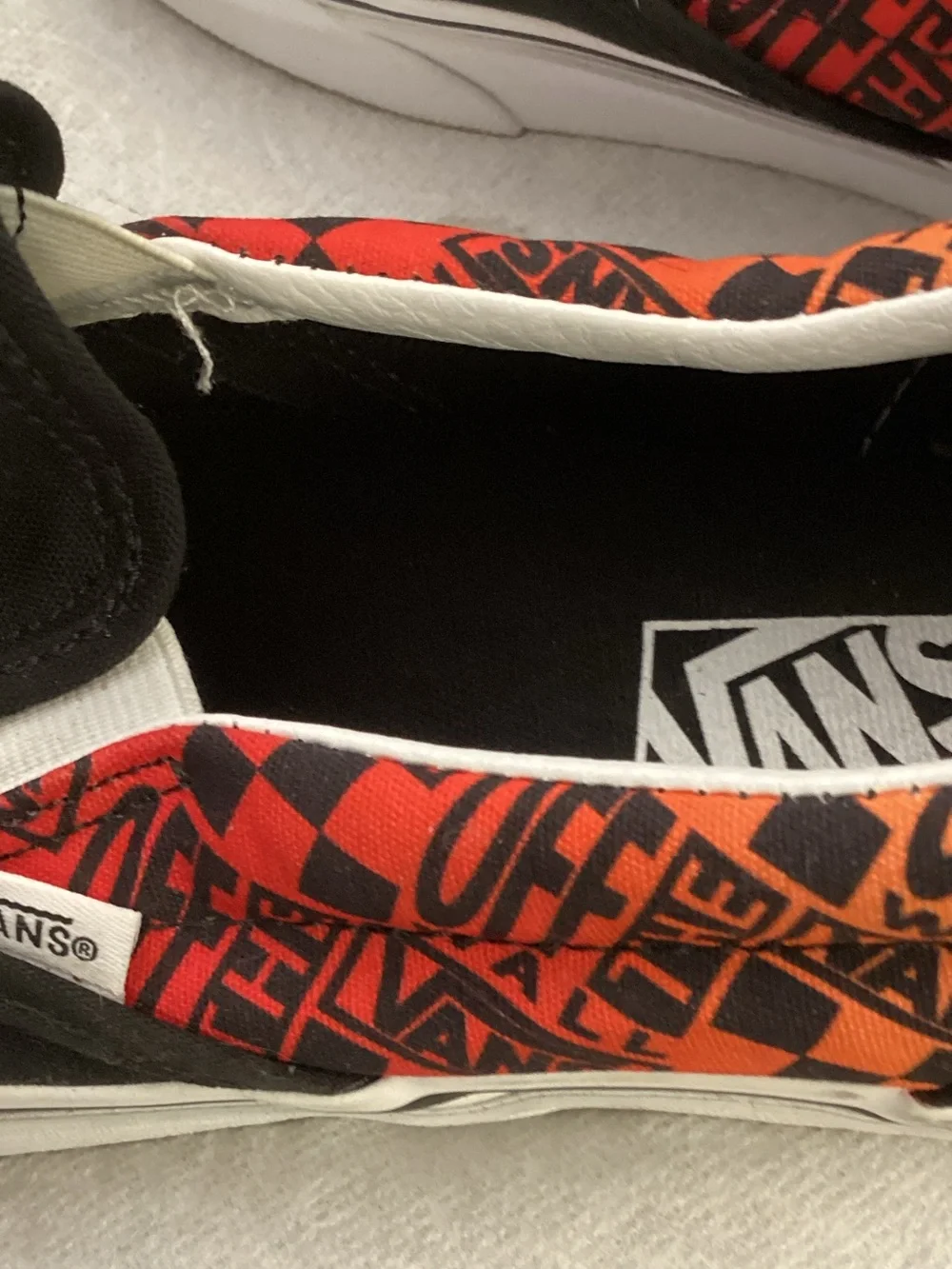 Vans Black Slip-On Loafers with Red and Orange Patterned Collar