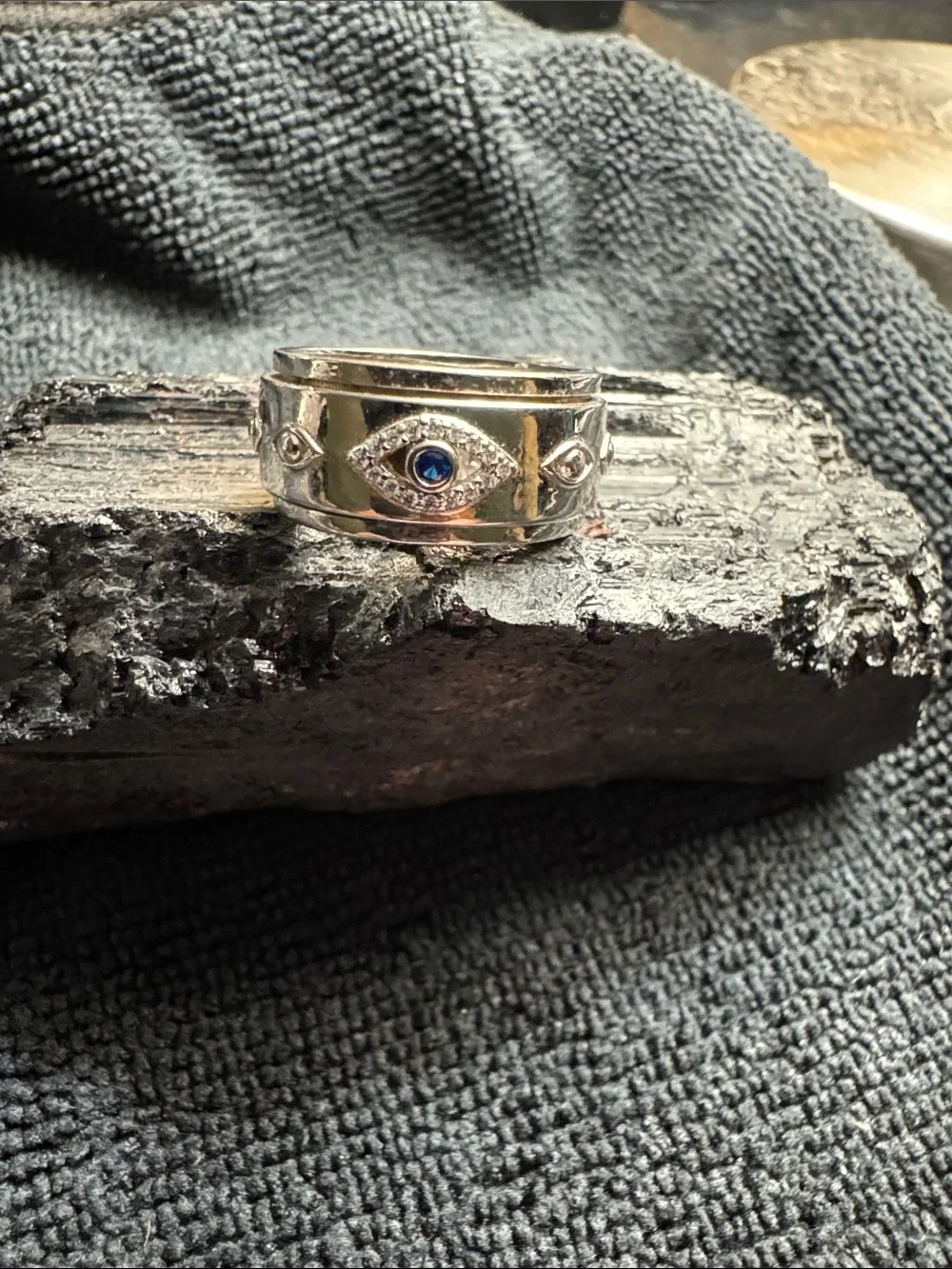 Silver Spinner Band Ring with Blue Stone Evil Eye Accent