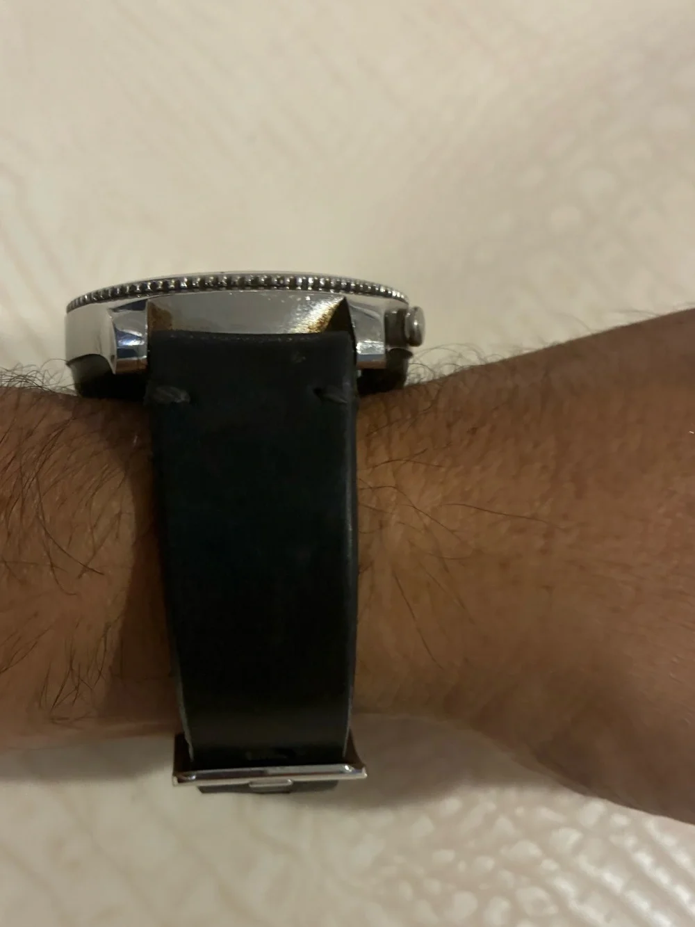 Samsung Silver Smartwatch with Black Strap and Blue Display