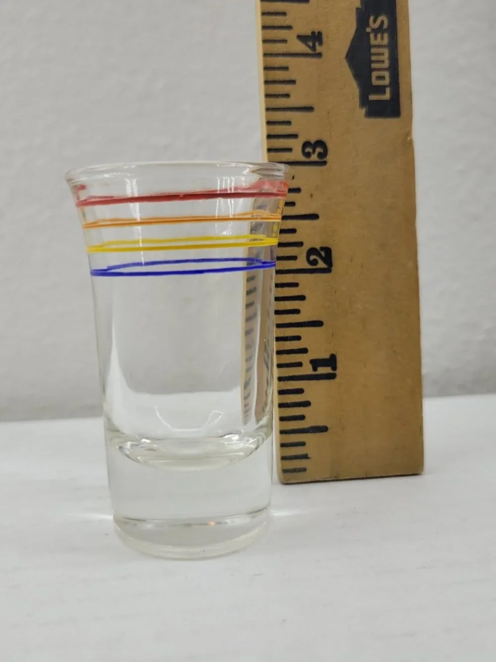 Vintage shot glass clear with orange red yellow blue stripes Mid-century Modern