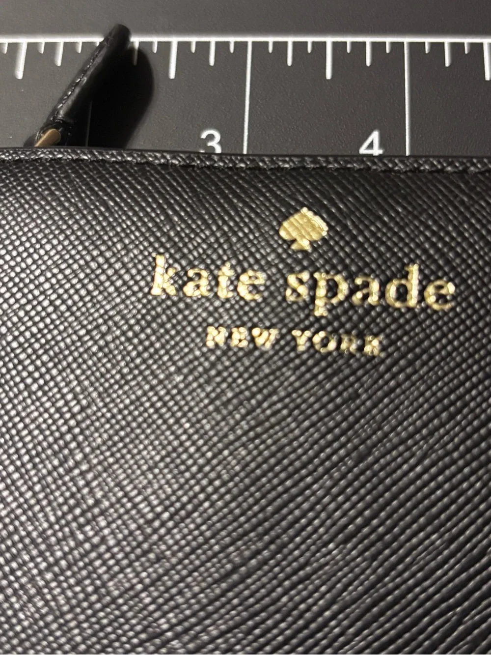 kate spade damage noted