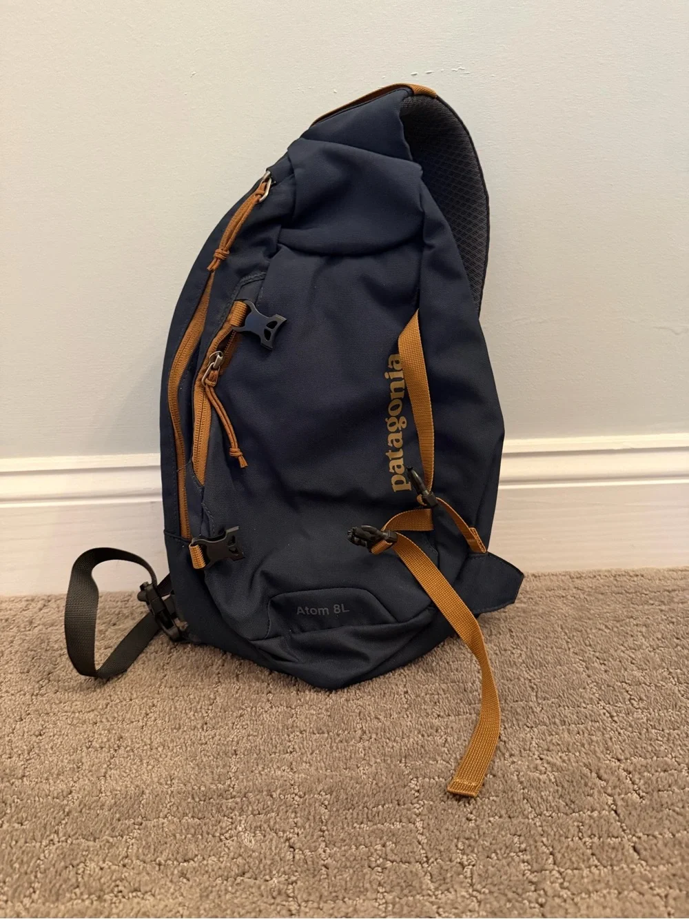 Patagonia Navy Blue Sling Backpack with Tan Accents