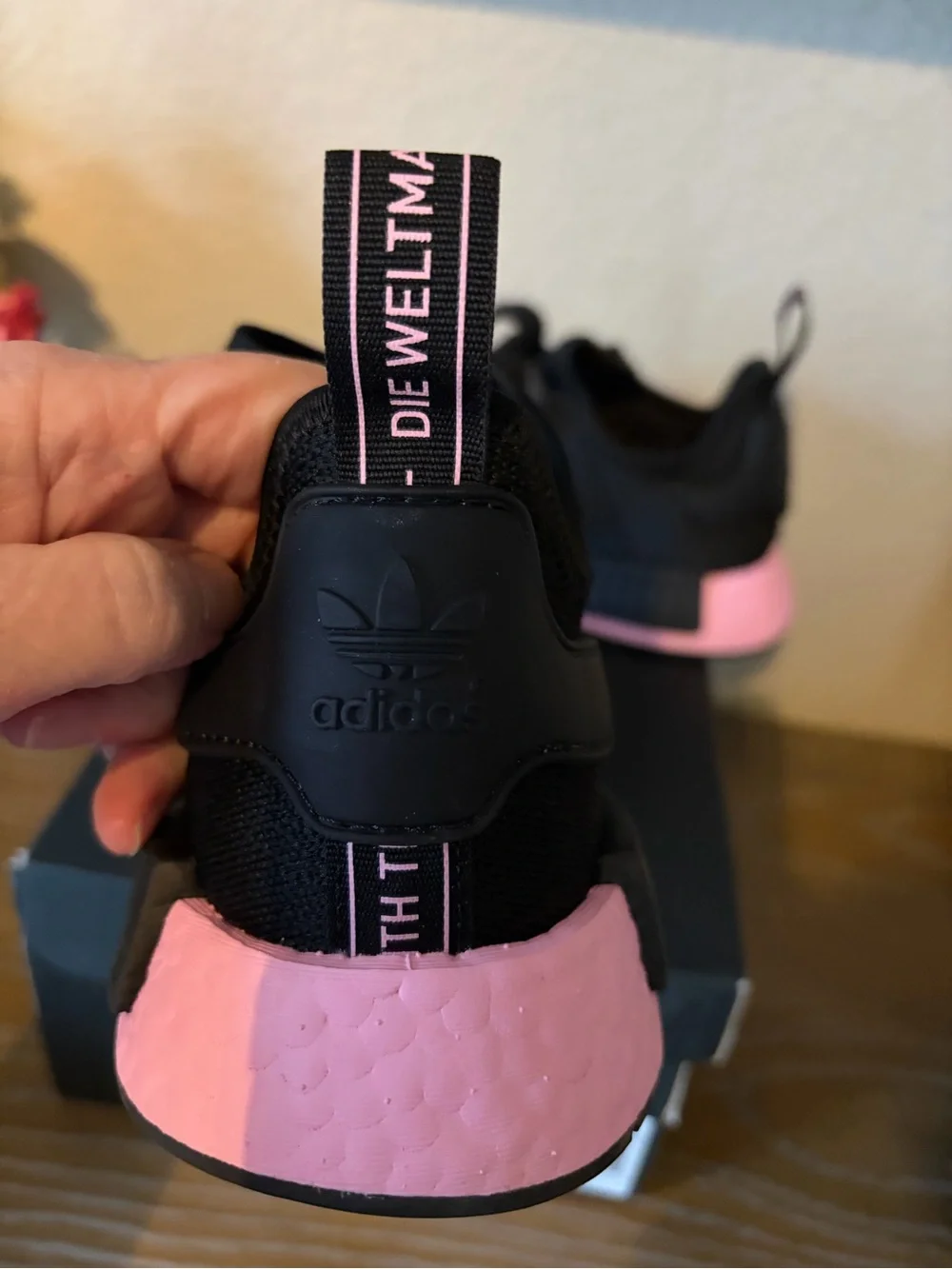 Women’s Adidas NMD R1 ‘Black True Pink’ sneakers.