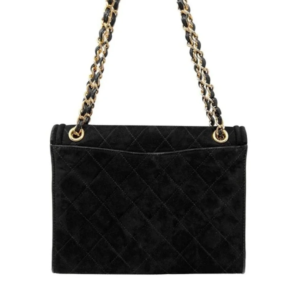 CHANEL black suede