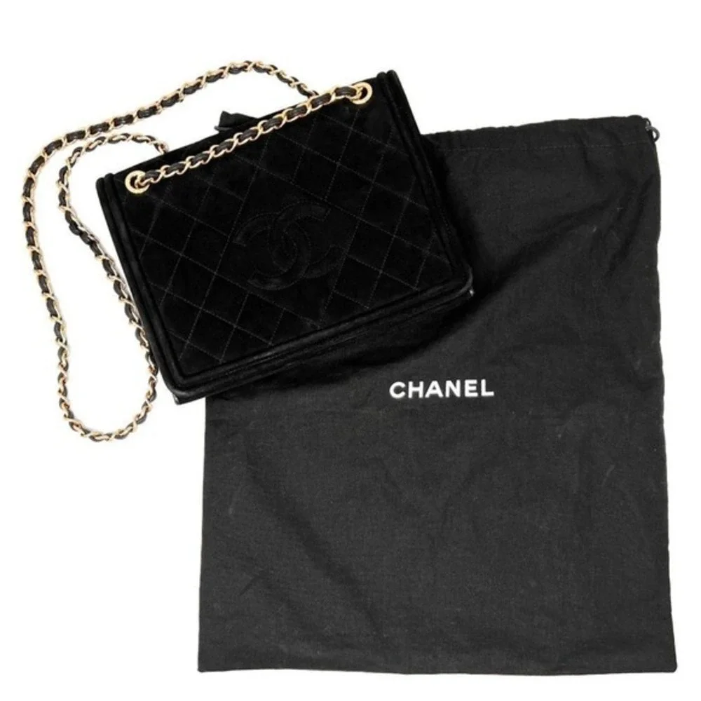 CHANEL black suede