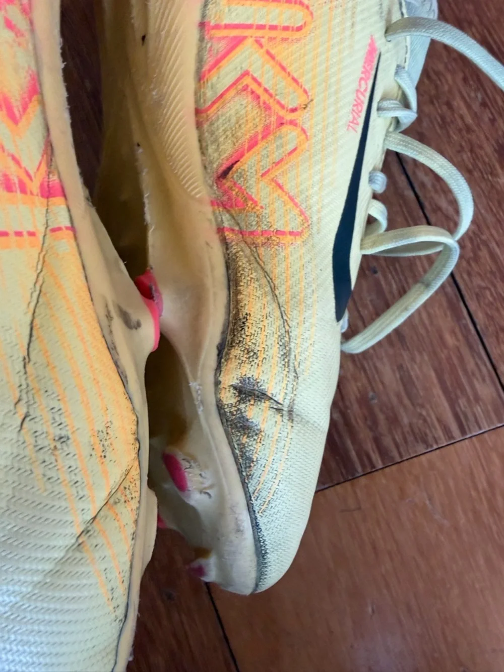Nike Yellow Soccer Cleats with Black Swoosh and Accents