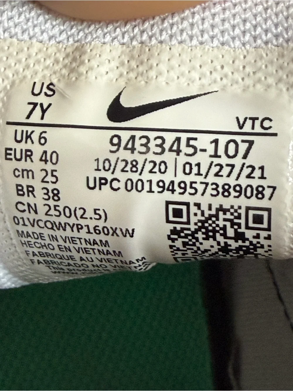 Nike Kids White Sneakers with Black, Orange and Green Accents