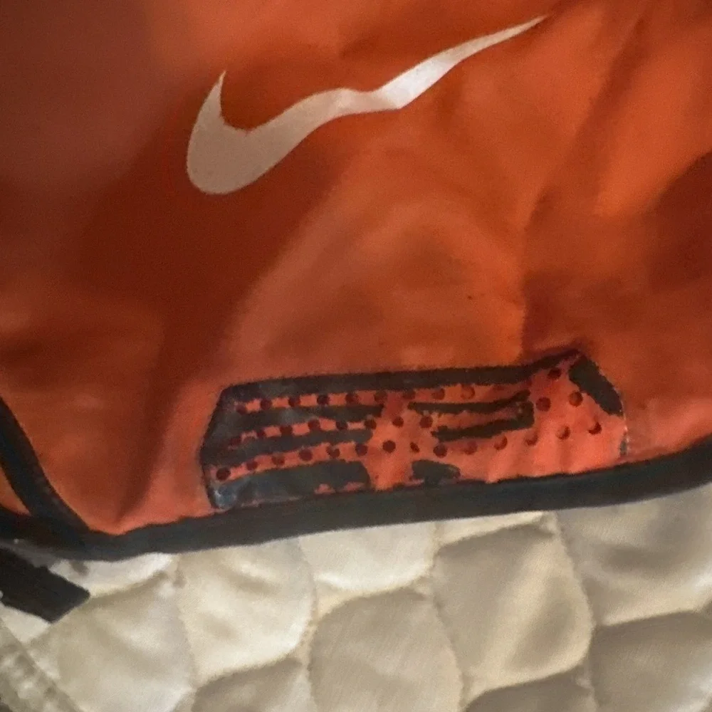Nike Brasilia 9.5 Training Gym Sack featuring a vibrant‎ orange White Swoosh